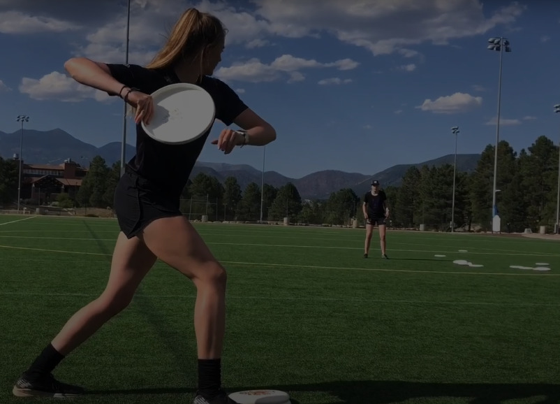 Jamie throwing a frisbee